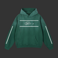 A forest green hoodie with crisp white front accents and a standout white crescent moon on the back, blending minimal design with bold energy.