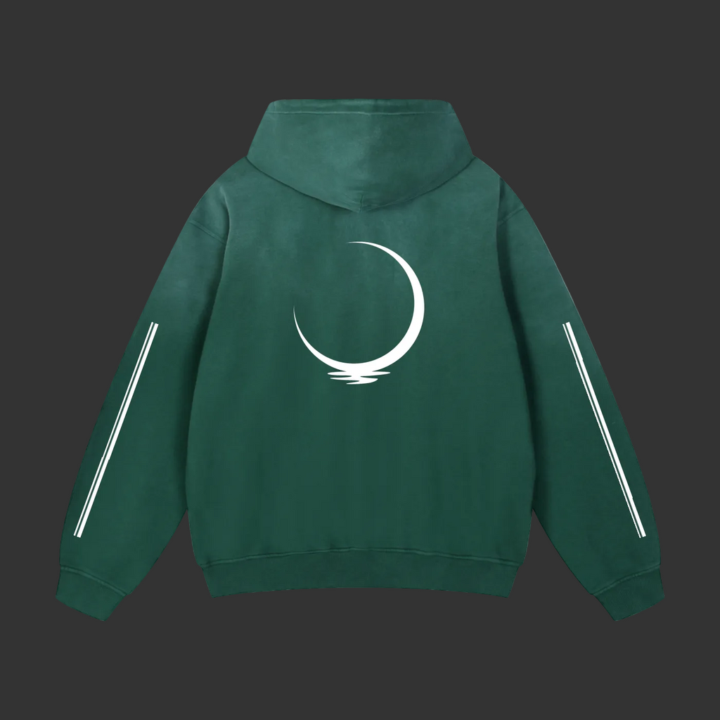 A forest green hoodie with crisp white front accents and a standout white crescent moon on the back, blending minimal design with bold energy.
